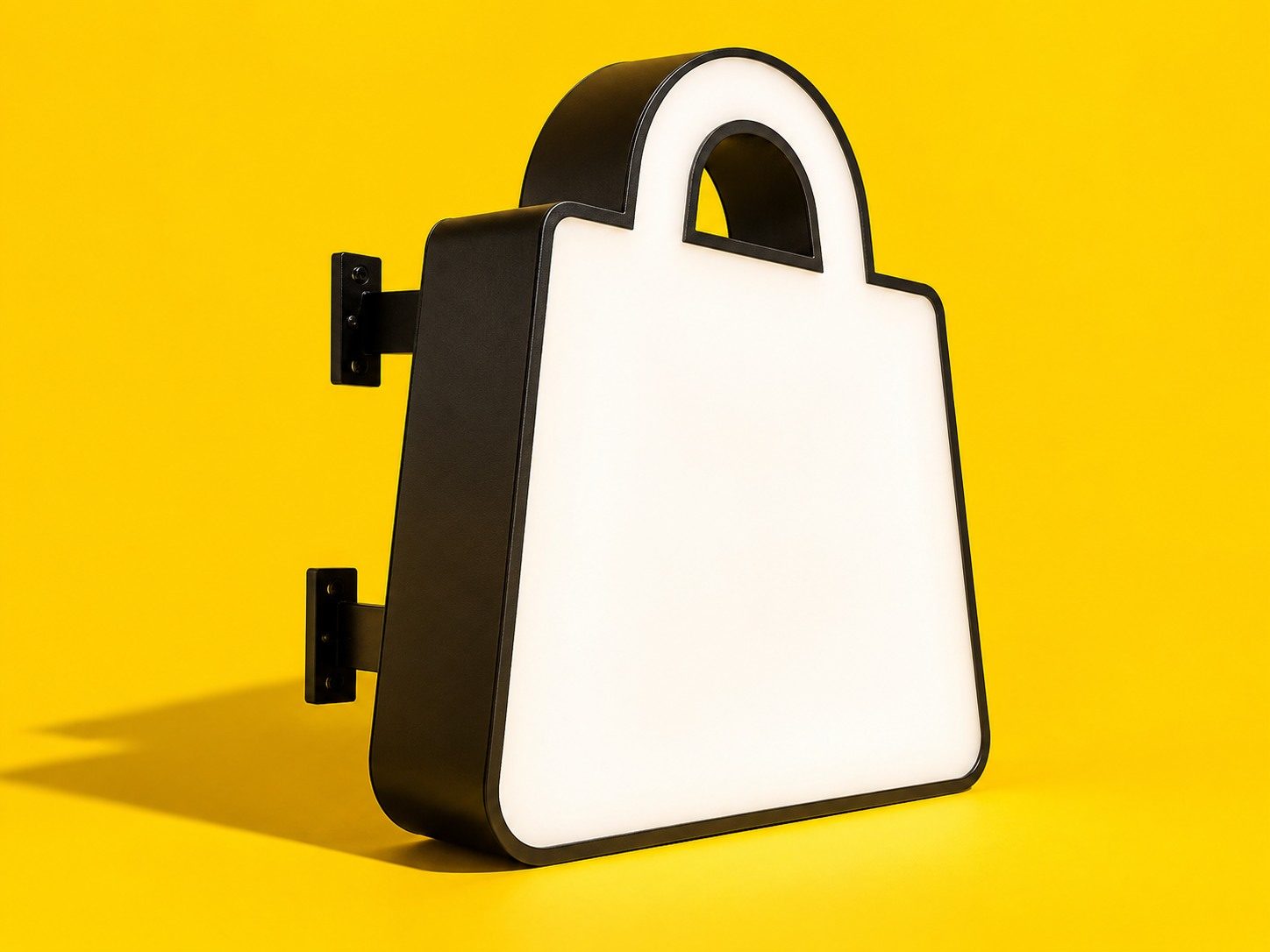 Световая вывеска для магазина в форме пакета: белое лицо, чёрные борта на жёлтом фоне